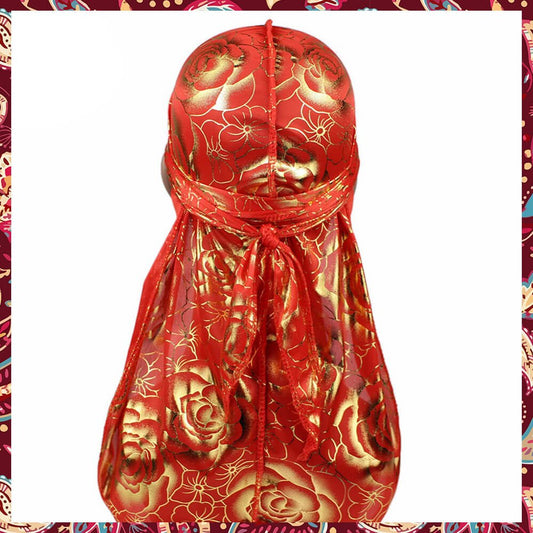 Silk gold and red durag, showcasing rose patterns.