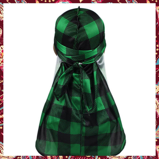 Silk durag with green and black tartan pattern.