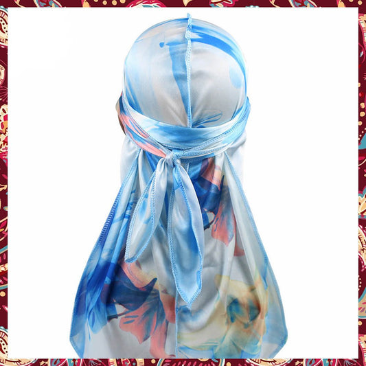 Pastel-toned silk durag featuring soft blue floral design.