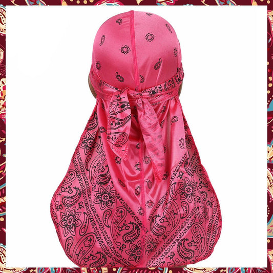 Silk durag radiating a soft pink with bandana design.