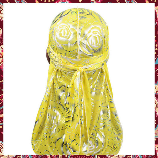 Silk yellow durag, showcasing rose patterns.